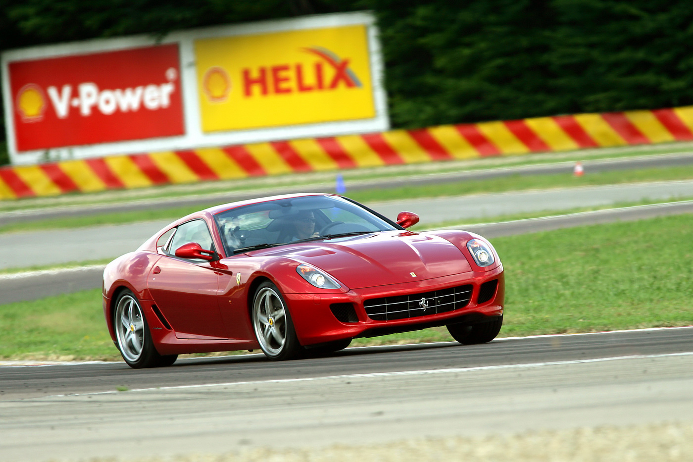 Автомобильные обзоры. Машина Ferrari 599 GTB Fiorano. Ferrari 599 GTB HGTE. Ferrari 599 GTO Шумахер. Ferrari 599 handling gt evoluzione.